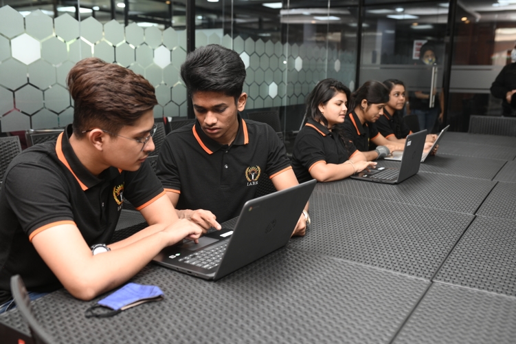 International Management & Analytics School Kolkata Student With Laptop photo 1